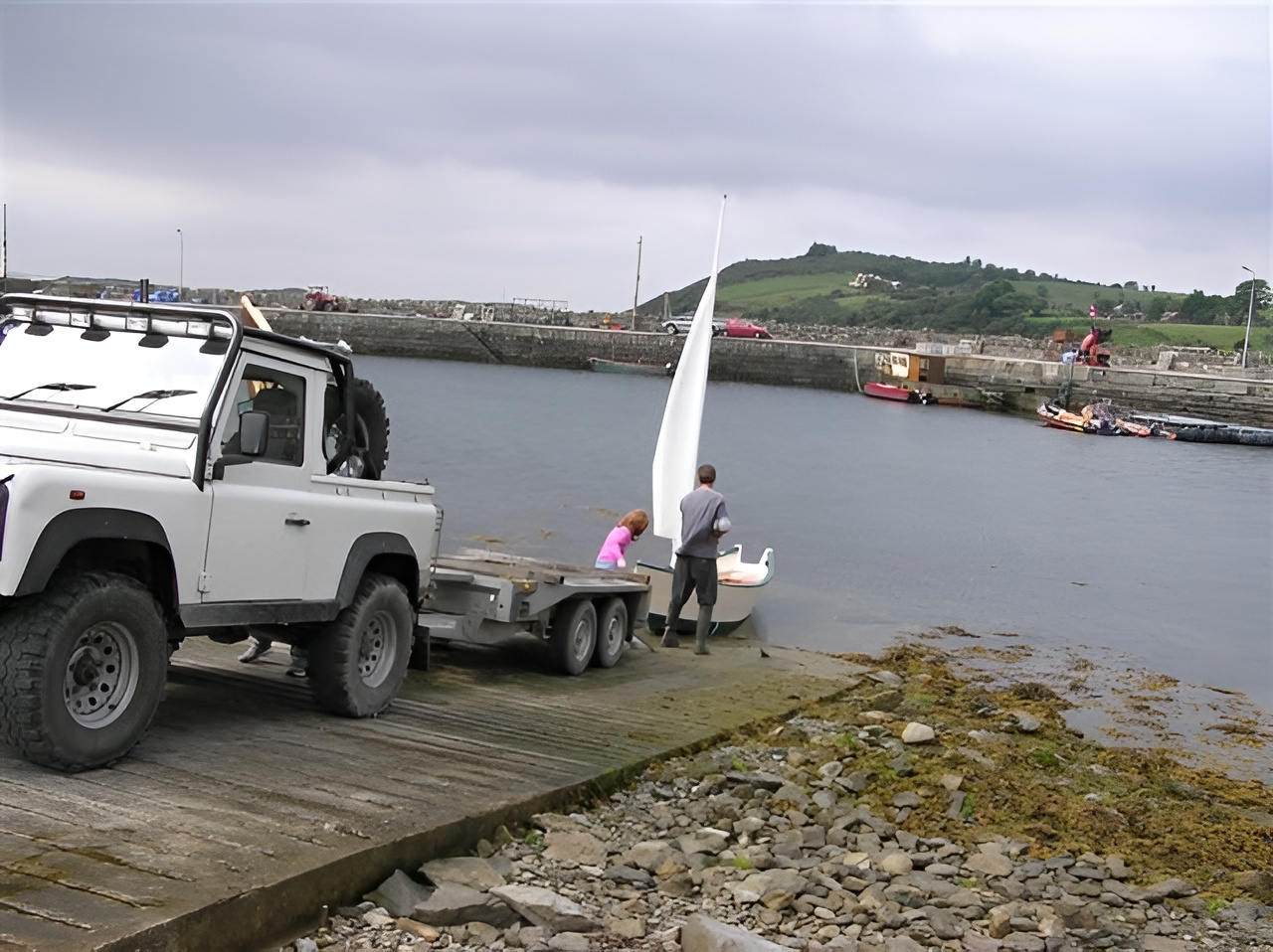 Customer-built Grand Banks dory being launched into the water