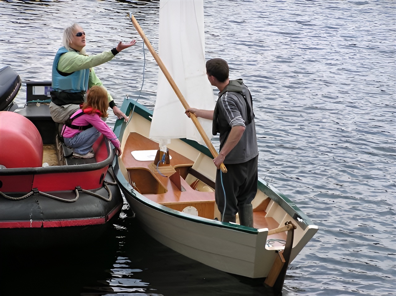 Customer-built Grand Banks dory being launched into the water