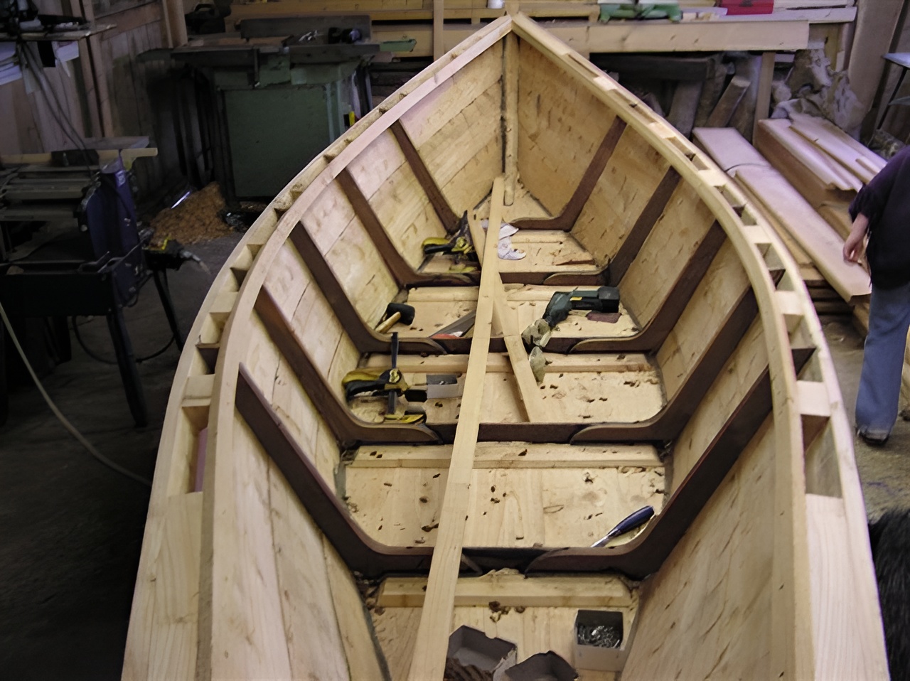 Grand Banks dory mid-build in a home workshop